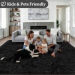 A black 8x10 Luxturiy fluffy shag area rug, shown spread out on a floor in a modern living room setting.